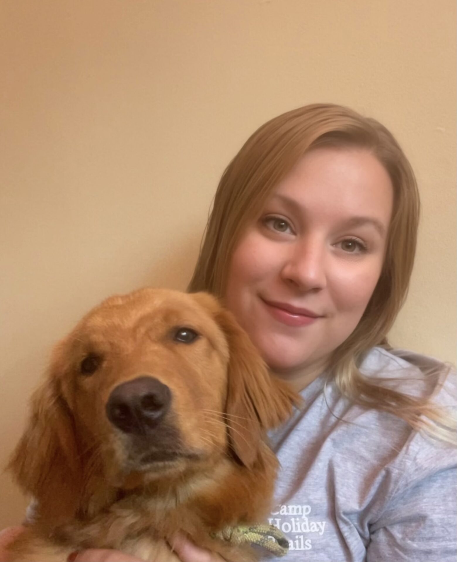 Marketing and Communications Coordinator Abby Wallace with dog